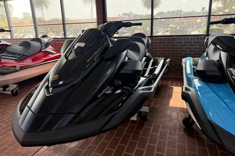 Slide: The Image of 2026 Yamaha WaveRunner FX Limited SVHO in showroom, sleek black design, brick floor background. - 8