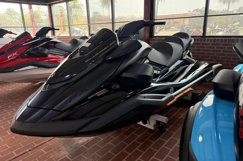 Slide: The Image of 2026 Yamaha WaveRunner FX Limited SVHO in showroom, sleek black design, parked indoors. - 9