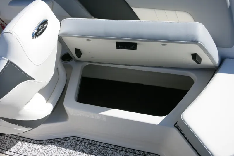 Slide: The Image of 2024 Chaparral 23 SSi OB boat interior storage compartment with open lid. - 12