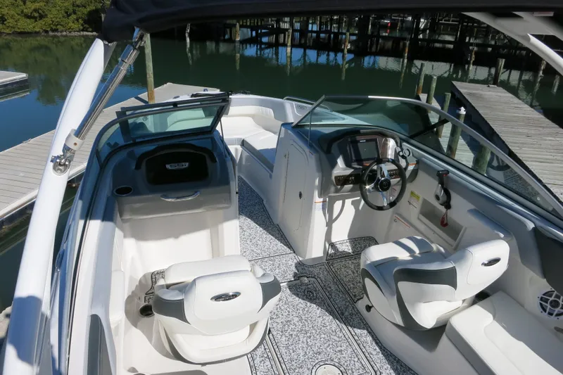 Slide: The Image of 2024 Chaparral 23 SSi OB boat interior with modern dashboard and seating. - 16
