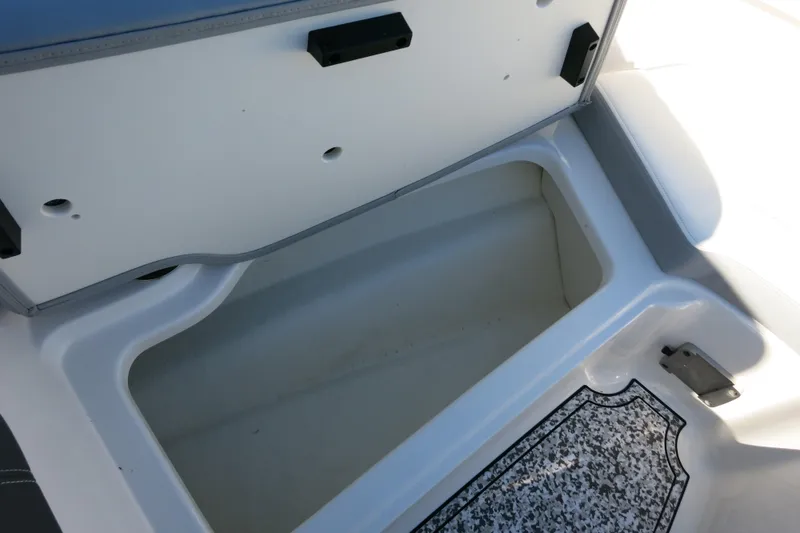 Slide: The Image of Open storage compartment in 2024 Chaparral 23 SSi OB boat. - 22