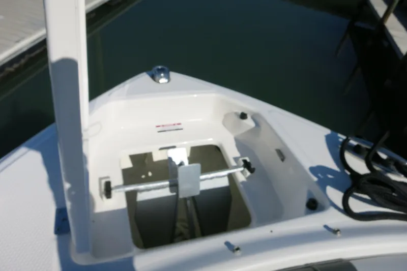 Slide: The Image of Bow anchor compartment of 2024 Chaparral 23 SSi OB boat at dock. - 25