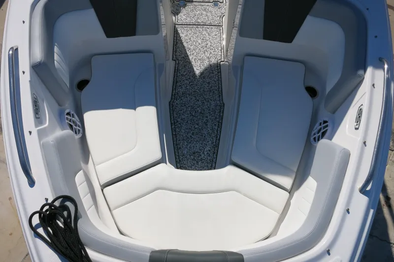 Slide: The Image of Interior view of 2024 Chaparral 23 SSi OB boat with white seating and speakers. - 26