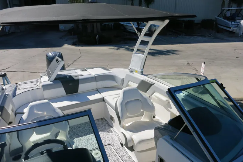 Slide: The Image of 2024 Chaparral 23 SSi OB boat interior with white seating and modern design. - 28