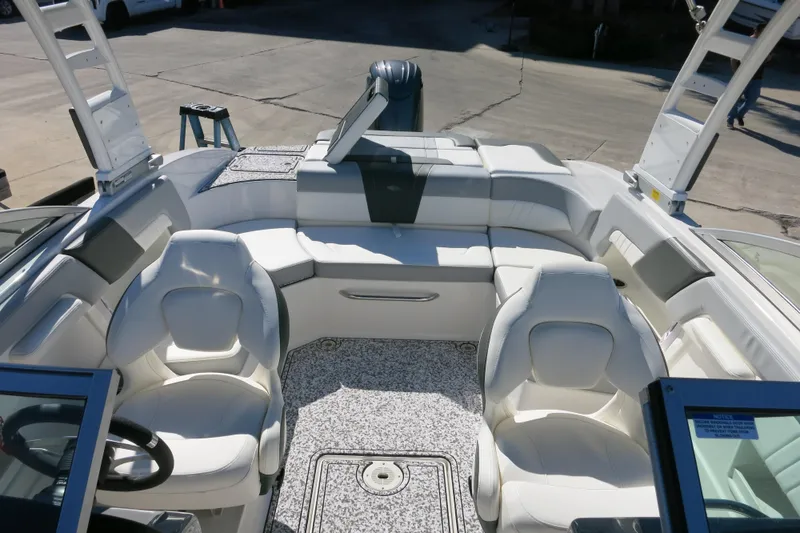 Slide: The Image of 2024 Chaparral 23 SSi OB boat interior with white seating and modern design. - 30