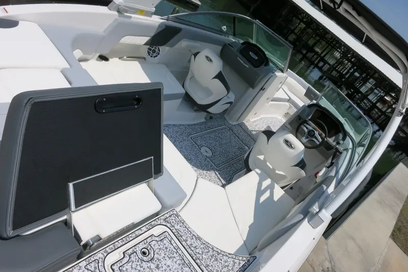 Slide: The Image of 2024 Chaparral 23 SSi OB boat interior with modern seating and steering console. - 36