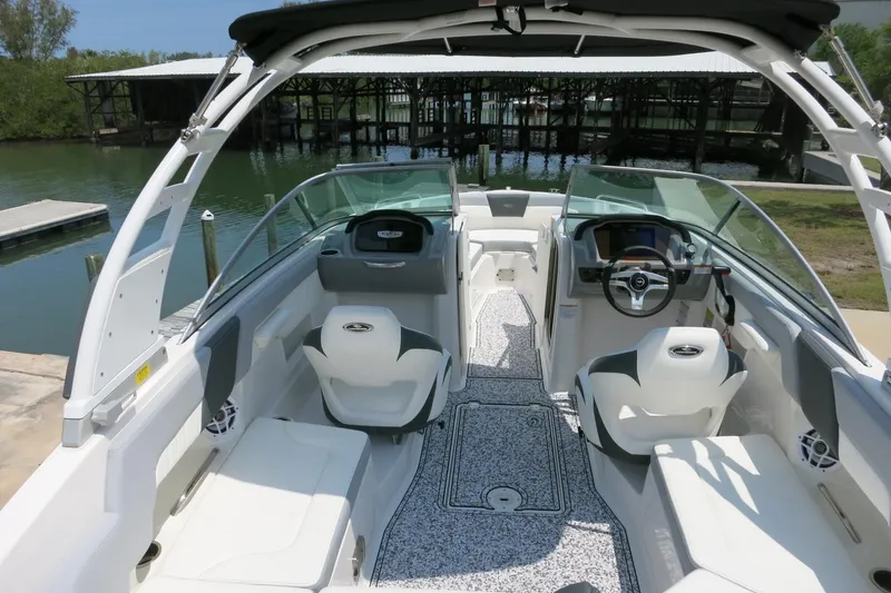 Slide: The Image of 2024 Chaparral 23 SSi OB boat interior with modern seating and sleek design. - 37