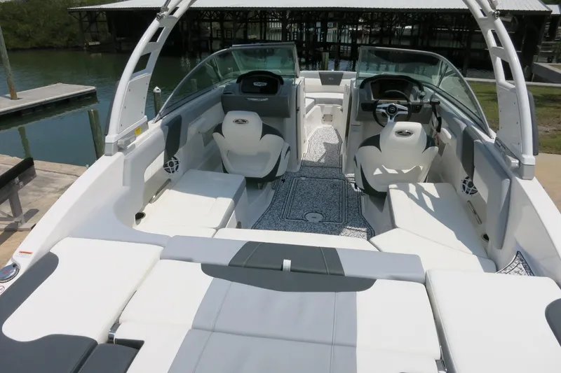 Slide: The Image of 2024 Chaparral 23 SSi OB boat interior with sleek seating and modern dashboard design. - 38