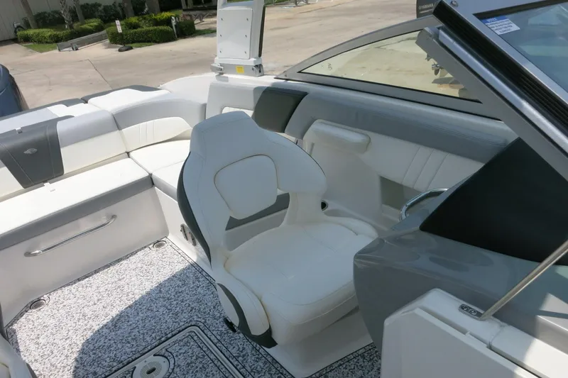 Slide: The Image of 2024 Chaparral 23 SSi OB boat interior with white seating and modern design. - 48