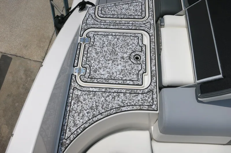 Slide: The Image of 2024 Chaparral 23 SSi OB boat deck with patterned flooring and seating. - 55