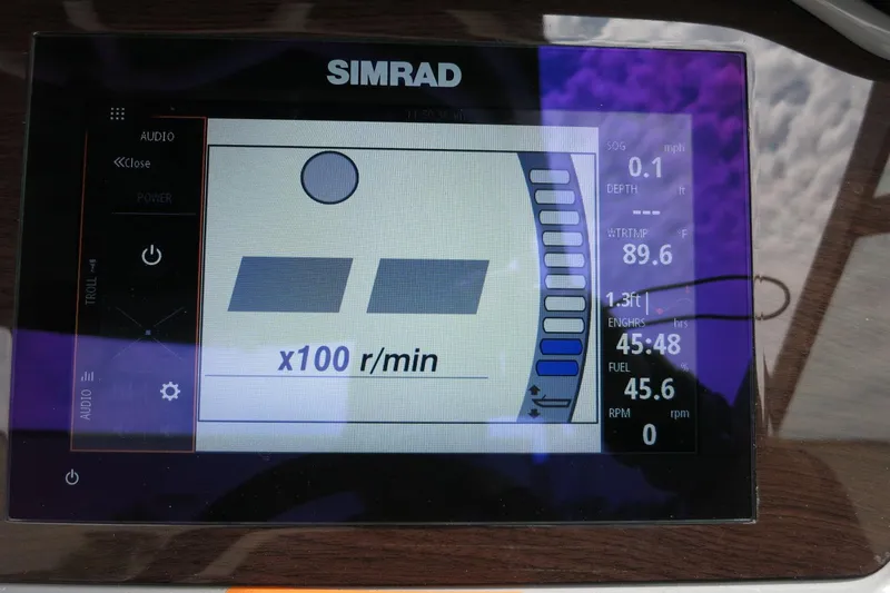 Slide: The Image of Simrad display on 2024 Chaparral 23 SSi OB showing engine metrics and navigation data. - 64