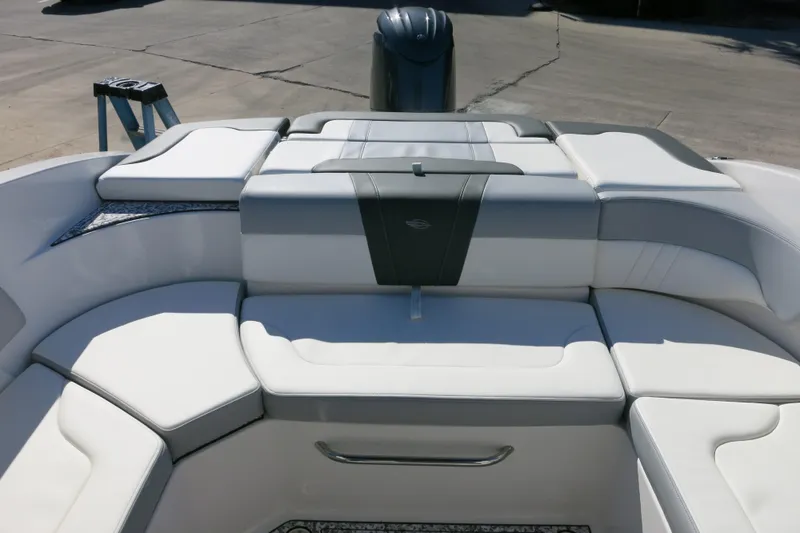 Slide: The Image of 2024 Chaparral 23 SSi OB boat interior with luxurious white seating and sleek design. - 8