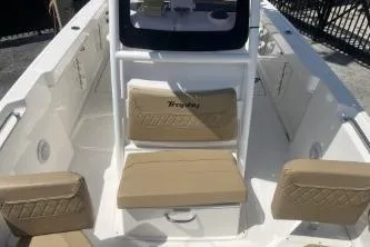 Slide: The Image of 2023 Trophy T24 CC boat interior with beige seating and modern design. - 11