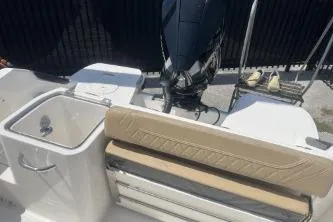 Slide: The Image of 2023 Trophy T24 CC boat interior with seating and motor. - 13