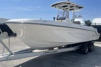 Slide: The Image of 2023 Trophy T24 CC boat on trailer, sleek design, ready for adventure. - 4