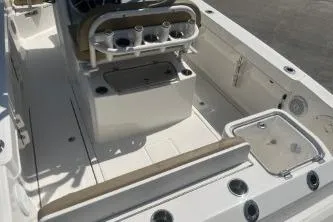 Slide: The Image of 2023 Trophy T24 CC boat interior with seating and storage compartments. - 7