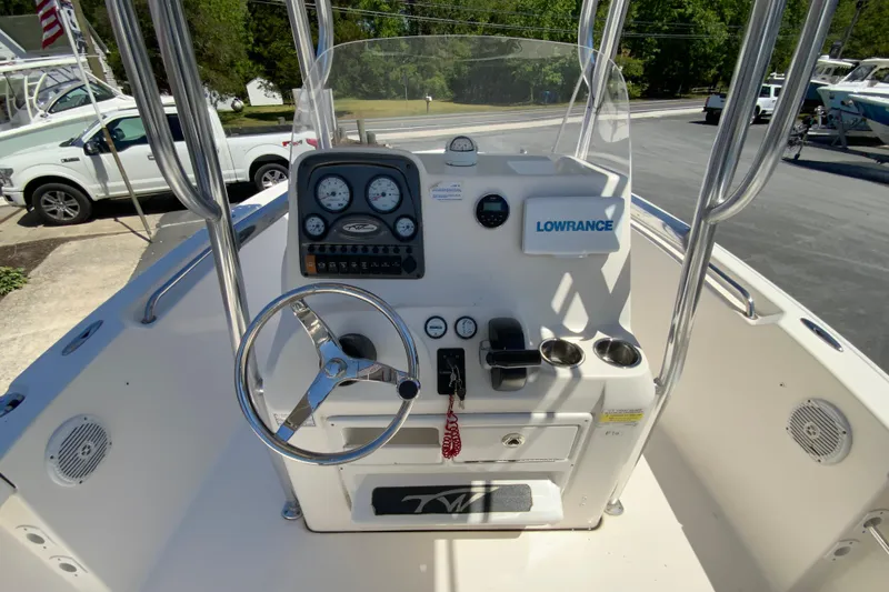 Slide: The Image of 2015 Tidewater 198 CC Adventure boat dashboard with steering wheel and Lowrance equipment. - 11