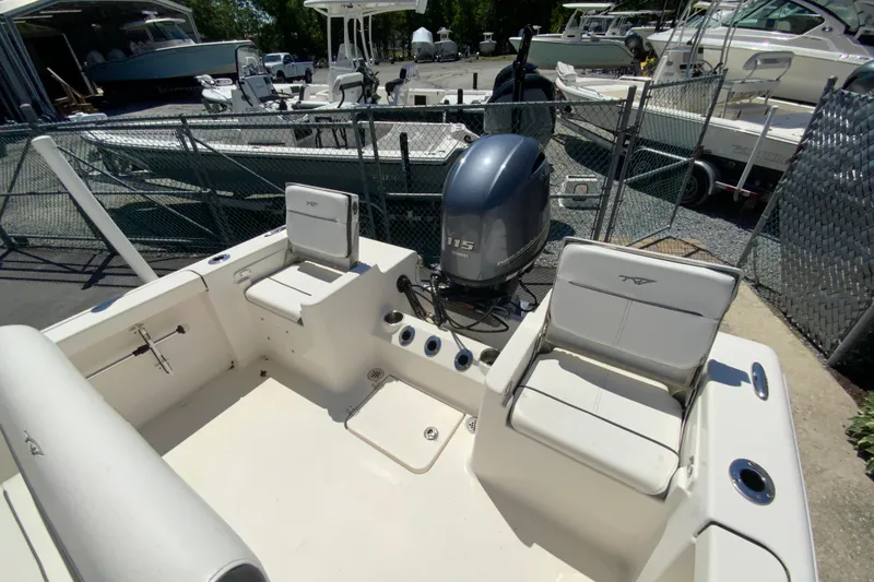 Slide: The Image of 2015 Tidewater 198 CC Adventure boat with Yamaha 115 engine, docked in a marina. - 15