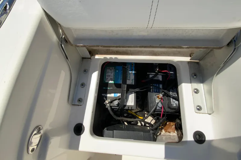 Slide: The Image of Battery compartment of a 2015 Tidewater 198 CC Adventure boat, showing wiring and connections. - 17