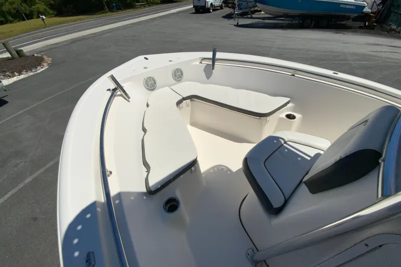 Slide: The Image of 2015 Tidewater 198 CC Adventure boat interior with cushioned seating and speakers. - 18