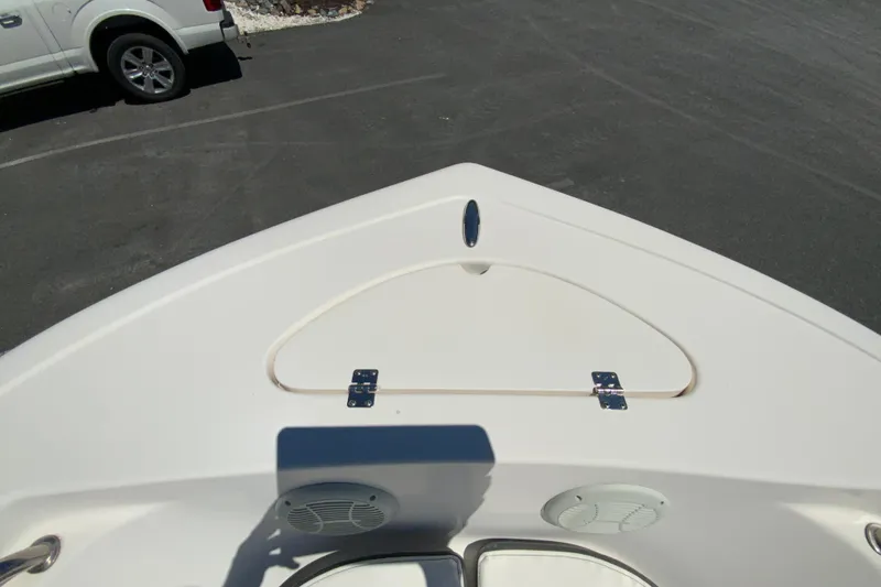 Slide: The Image of Bow view of 2015 Tidewater 198 CC Adventure boat, featuring storage compartment and speakers. - 19