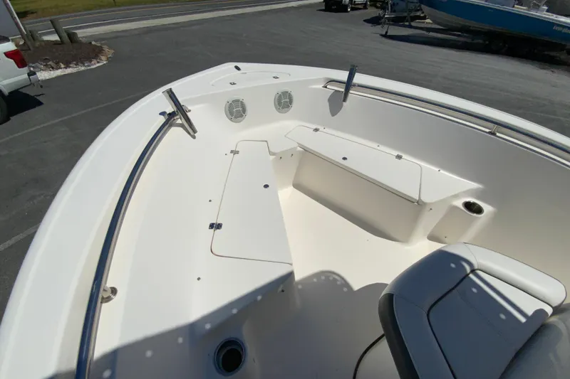 Slide: The Image of 2015 Tidewater 198 CC Adventure boat interior with seating and storage compartments. - 21