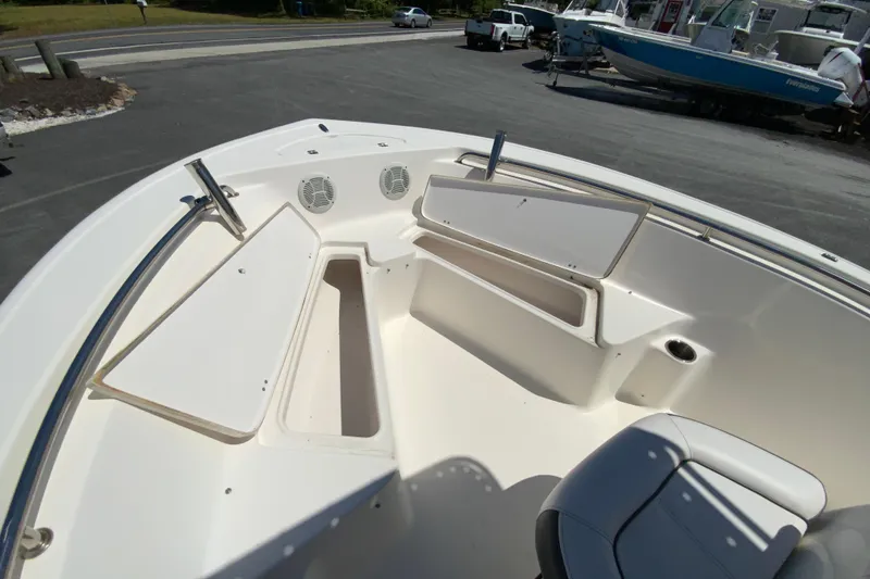 Slide: The Image of 2015 Tidewater 198 CC Adventure boat interior with seating and storage compartments. - 22