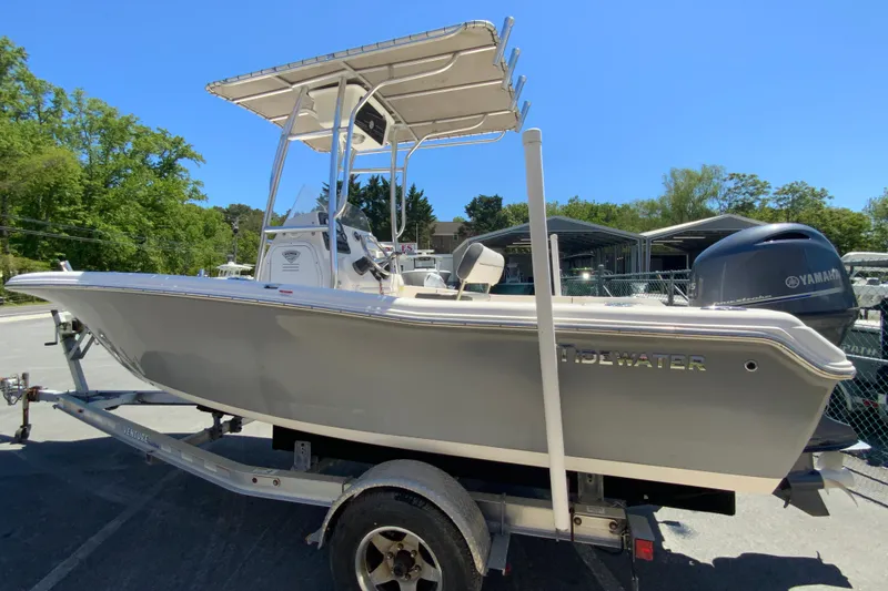 Slide: The Image of 2015 Tidewater 198 CC Adventure boat on trailer, featuring Yamaha outboard motor. - 7