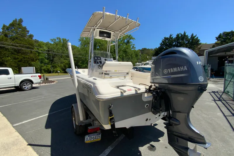 Slide: The Image of 2015 Tidewater 198 CC Adventure boat with Yamaha 115 engine, parked outdoors. - 8