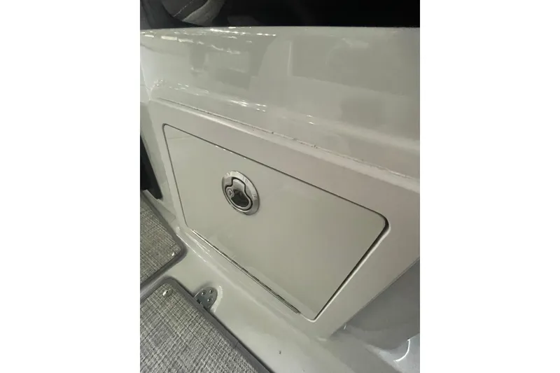 Slide: The Image of Storage compartment on a 2022 Finseeker 280 DC boat, featuring a sleek design. - 15