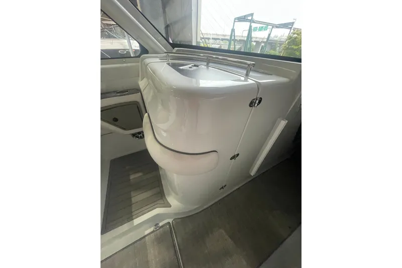 Slide: The Image of Interior view of 2022 Finseeker 280 DC boat, showcasing sleek cabinetry and modern design. - 17