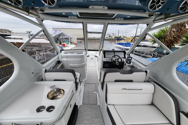 Slide: The Image of Interior of 2022 Finseeker 280 DC boat with modern helm and seating. - 3