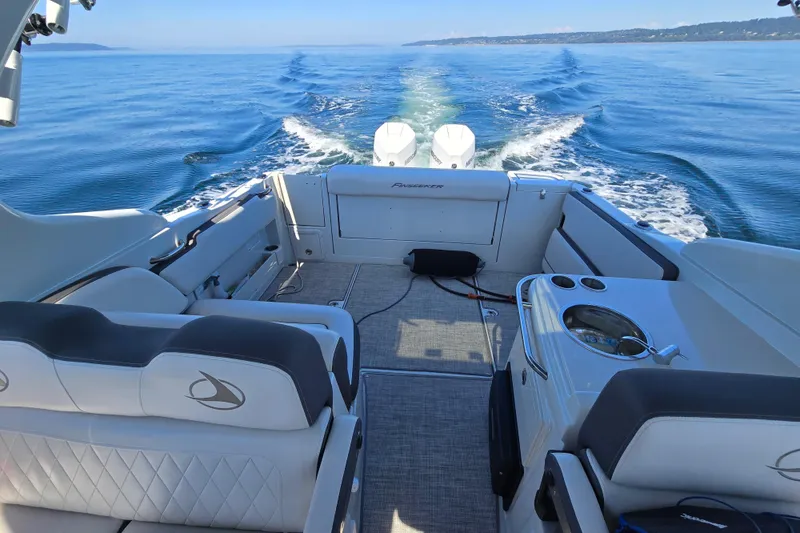 Slide: The Image of 2022 Finseeker 280 DC boat cruising on open water, showcasing spacious seating and sleek design. - 7