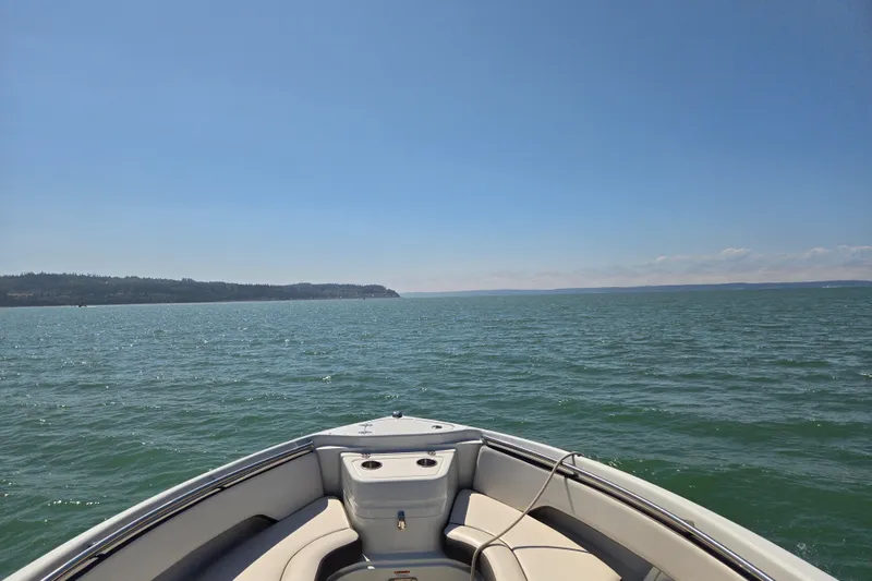 Slide: The Image of Bow view of 2022 Finseeker 280 DC on open water under clear blue sky. - 9