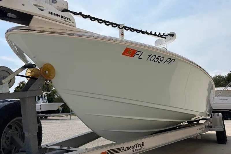Slide: The Image of 2013 Sportsman Masters 207 Bay Boat on trailer, featuring Minn Kota motor. - 12