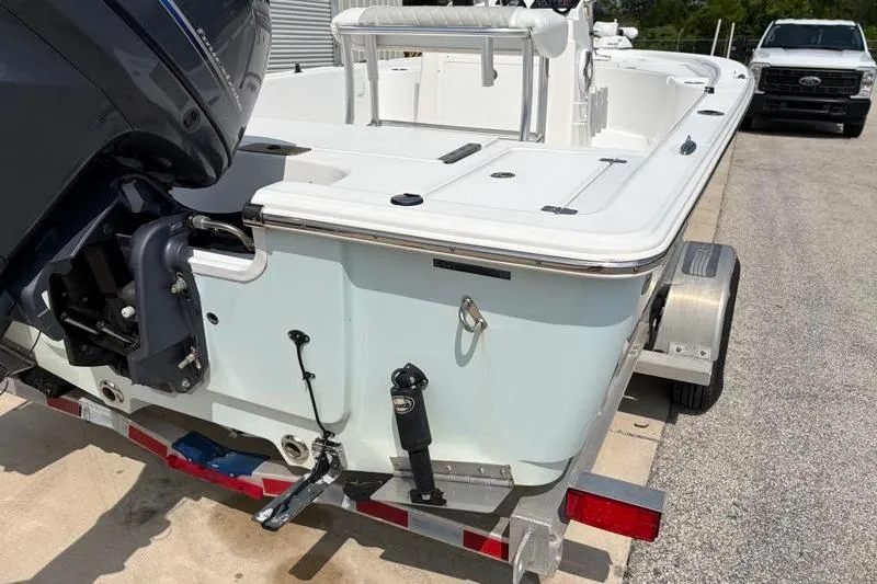 Slide: The Image of 2013 Sportsman Masters 207 Bay Boat on trailer, rear view with outboard motor. - 15