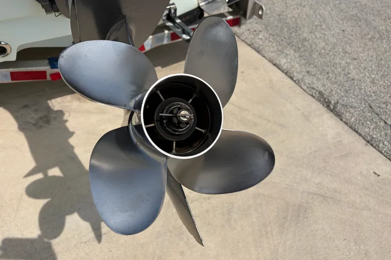 Slide: The Image of Propeller of a 2013 Sportsman Masters 207 Bay Boat on a concrete surface. - 17