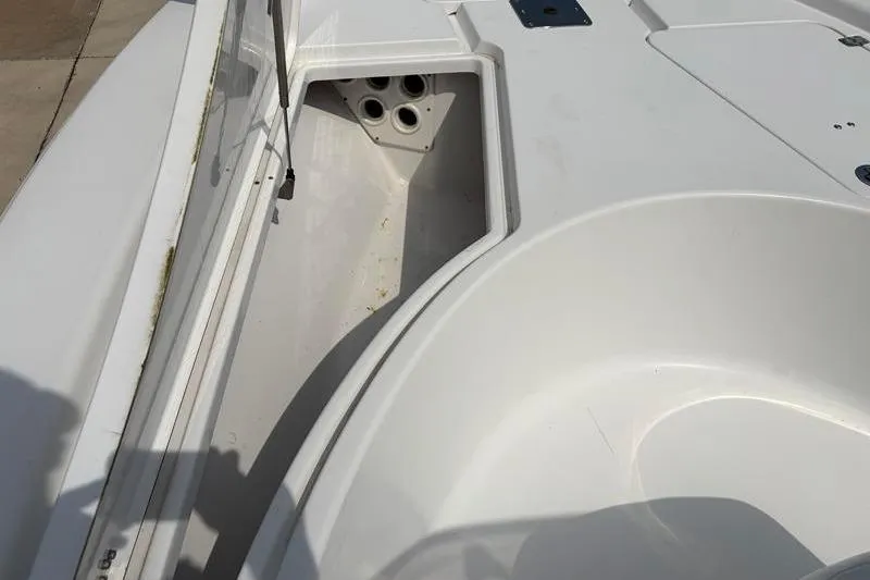 Slide: The Image of 2013 Sportsman Masters 207 Bay Boat storage compartment with open hatch. - 19
