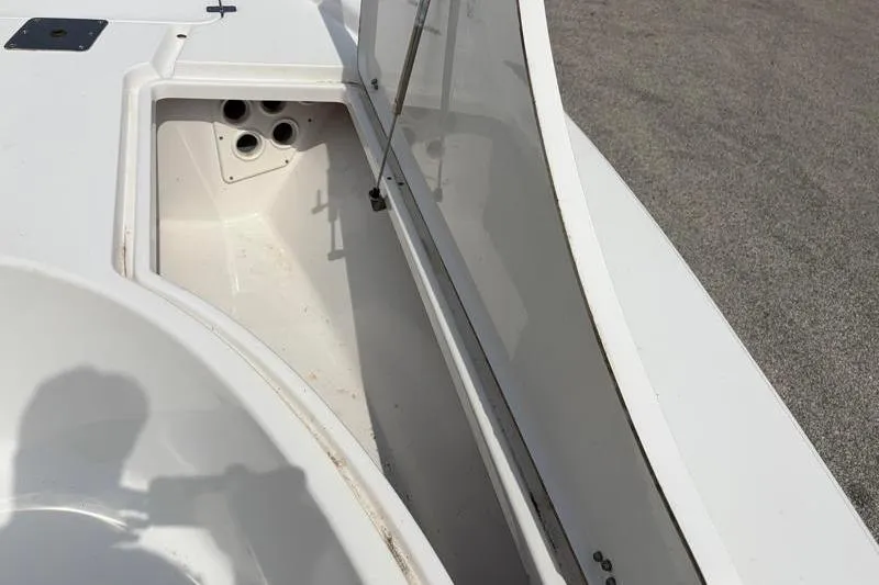 Slide: The Image of Open storage compartment on a 2013 Sportsman Masters 207 Bay Boat. - 20