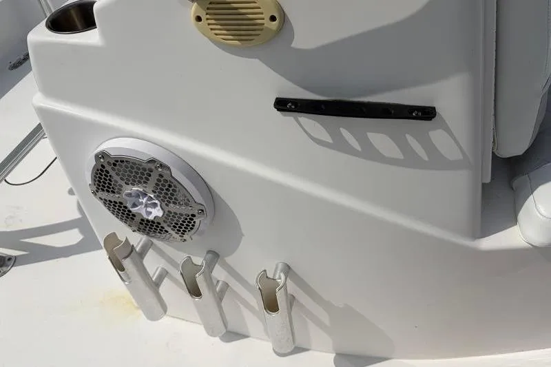 Slide: The Image of 2013 Sportsman Masters 207 Bay Boat interior with rod holders and speaker. - 28