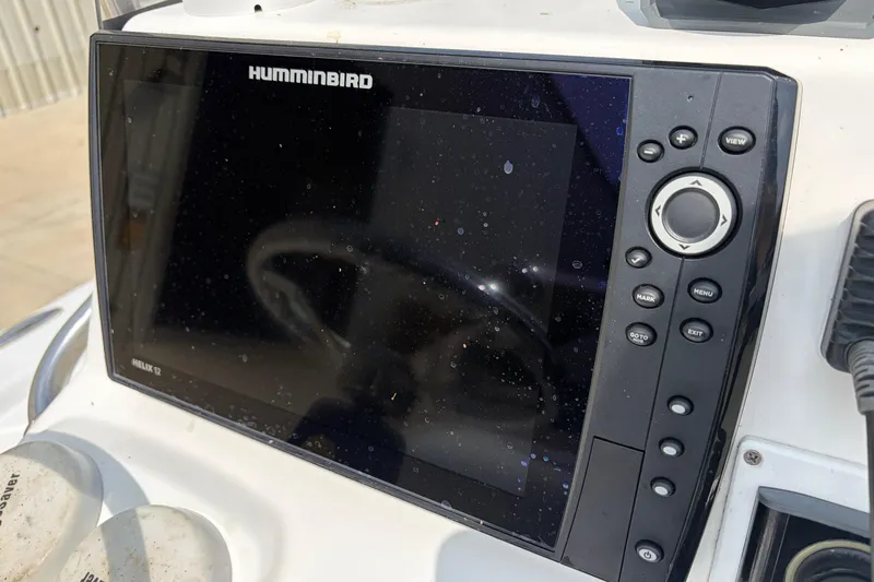 Slide: The Image of Humminbird Helix 12 fishfinder on 2013 Sportsman Masters 207 Bay Boat dashboard. - 31