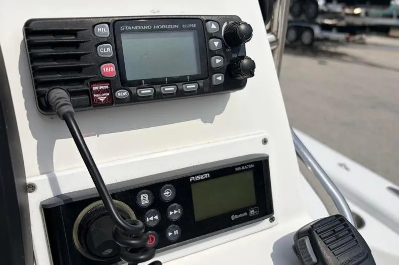 Slide: The Image of Control panel of a 2013 Sportsman Masters 207 Bay Boat with radio equipment. - 32