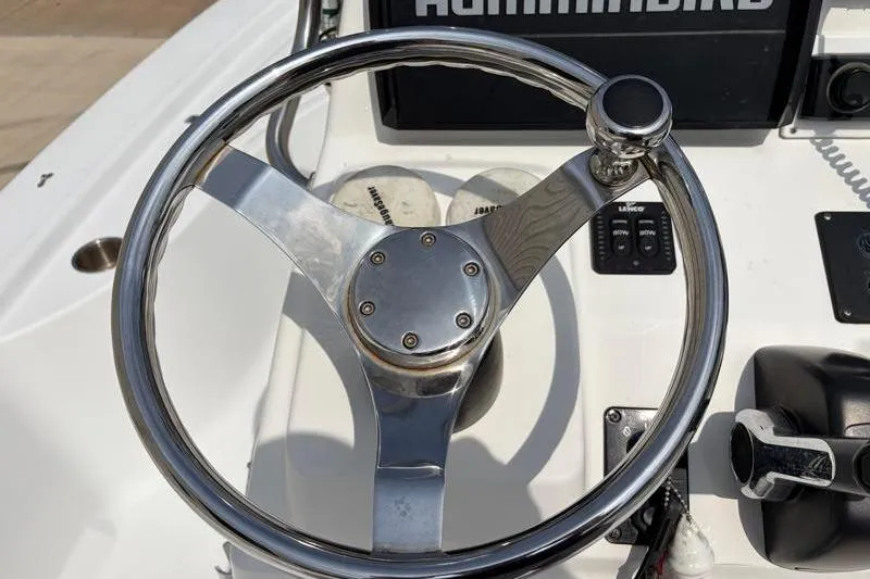 Slide: The Image of Steering wheel of a 2013 Sportsman Masters 207 Bay Boat with control panel. - 35