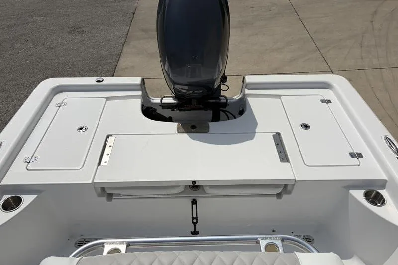 Slide: The Image of 2013 Sportsman Masters 207 Bay Boat with outboard motor, featuring spacious deck layout. - 36