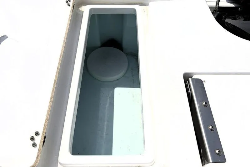 Slide: The Image of 2013 Sportsman Masters 207 Bay Boat storage compartment, open and empty. - 39