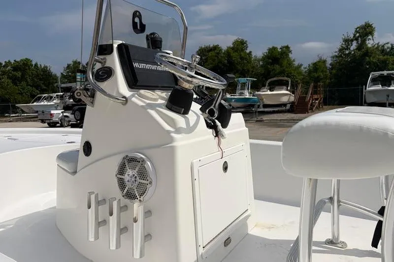 Slide: The Image of 2013 Sportsman Masters 207 Bay Boat console with steering wheel and seating. - 40
