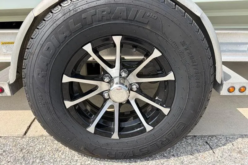 Slide: The Image of Close-up of a Radial Trail tire on a 2013 Sportsman Masters 207 Bay Boat trailer. - 43
