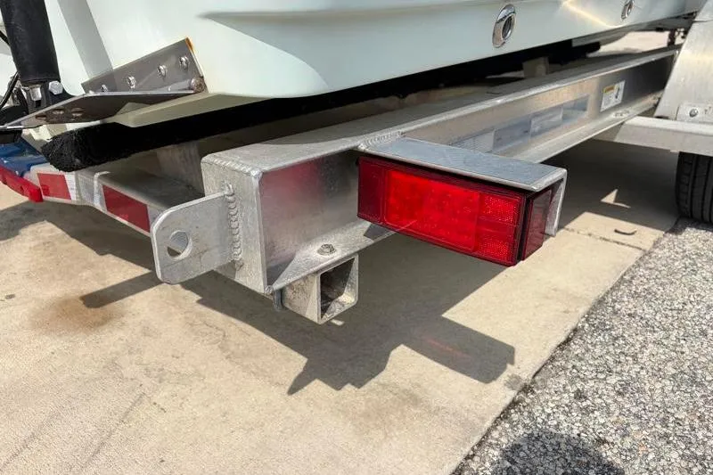 Slide: The Image of Trailer hitch and taillight of a 2013 Sportsman Masters 207 Bay Boat. - 44