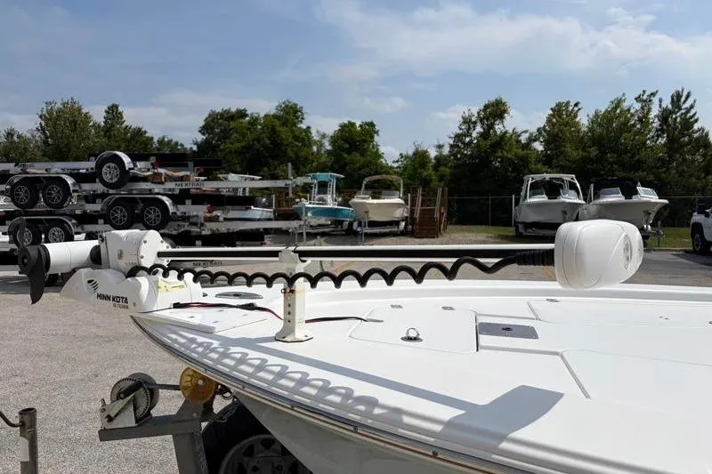 Slide: The Image of 2013 Sportsman Masters 207 Bay Boat with Minn Kota trolling motor in a boatyard. - 6