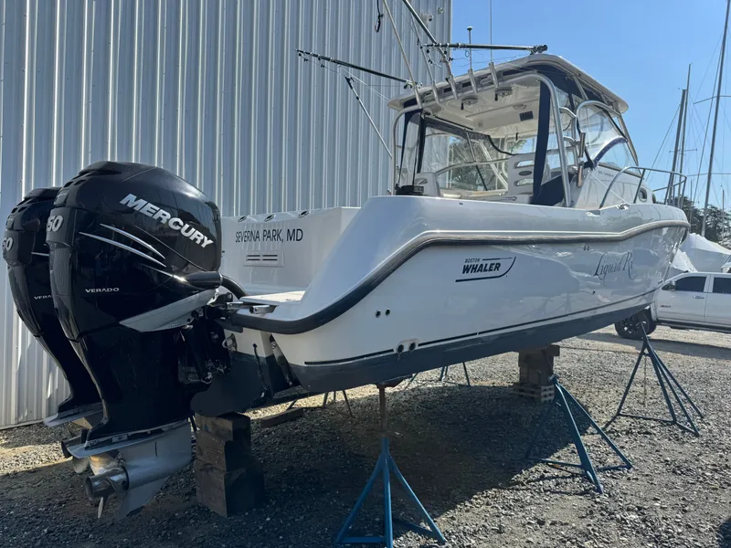 Slide: The Image of 2006 Boston Whaler 305 Conquest boat with Mercury engines. - 10